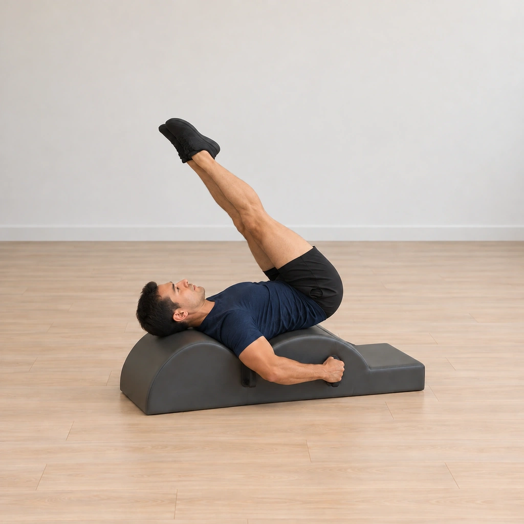 His legs have lifted and reached over toward the barrel, long and together, his elbows wide on the handles and his neck long.