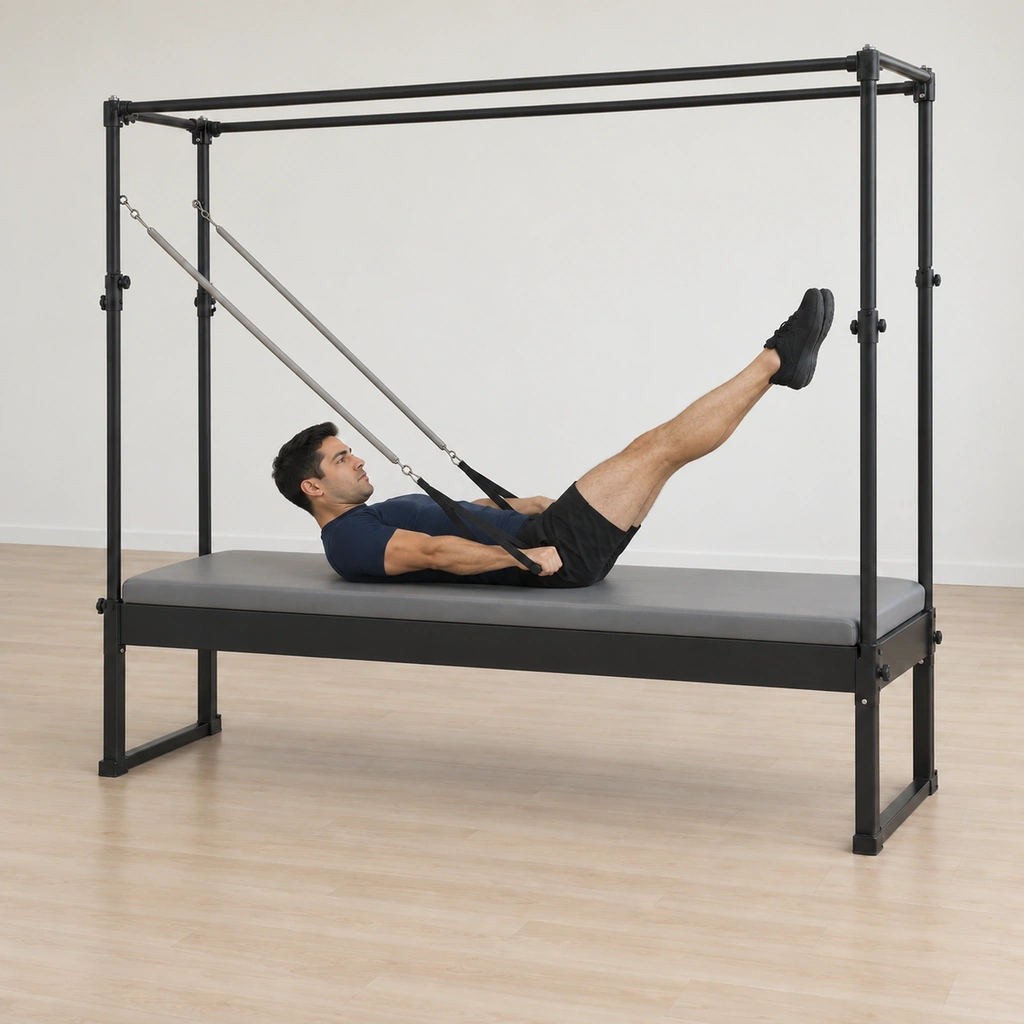 His arms and legs have pressed straight simultaneously - the arms low near the mat resisting the springs, the legs reaching to a diagonal with heels still together, his curl still held and his elbows tracking in.