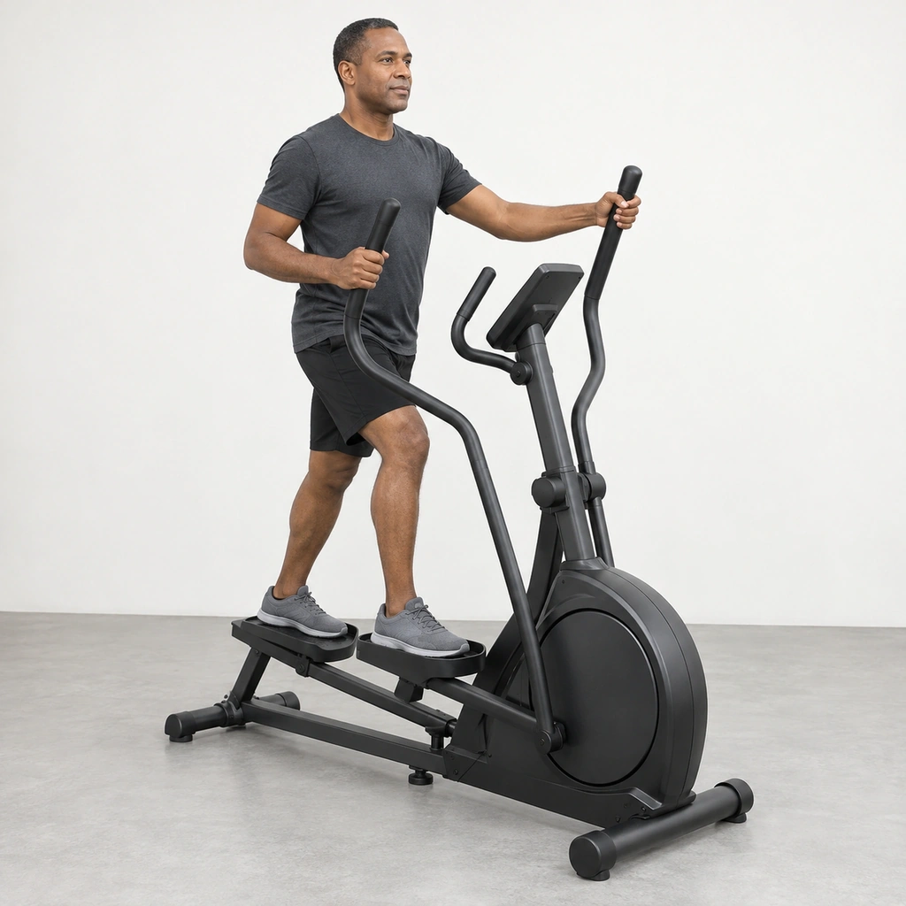 Man on an elliptical cross trainer with his right foot forward and his left hand pushing the left handle bar forward.