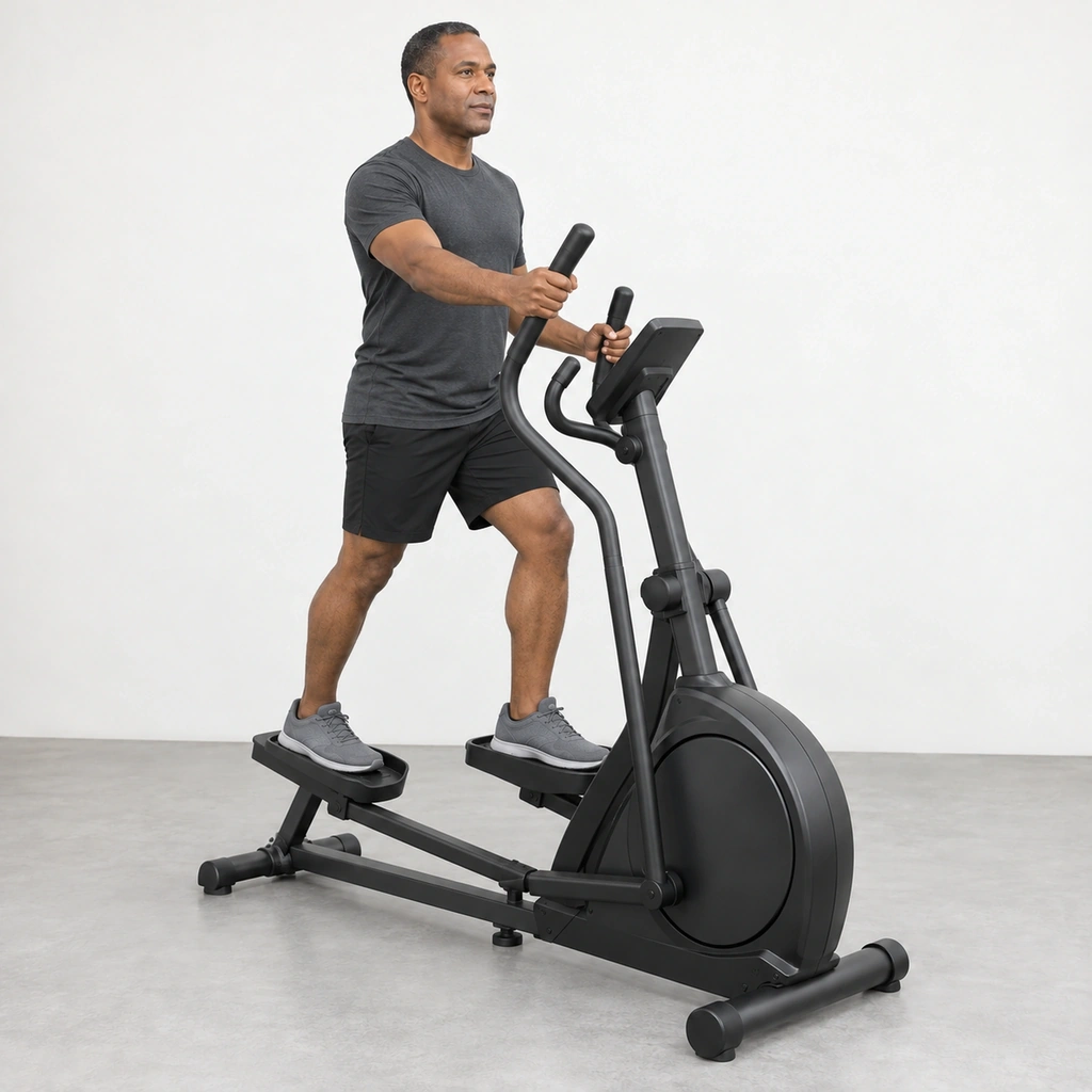 Man on an elliptical cross trainer with his left foot forward and his right hand pushing the right handle bar forward.