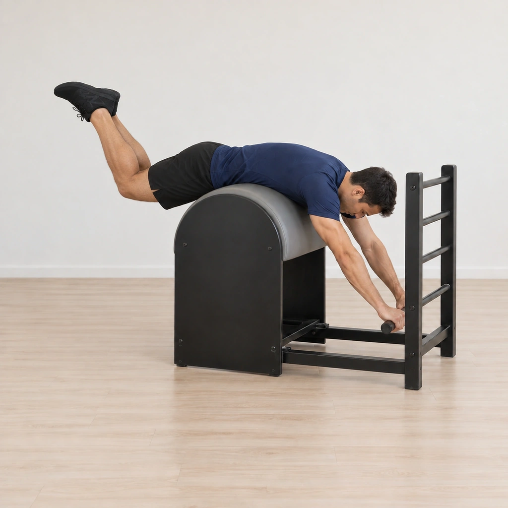 His legs lift behind him in the bent grasshopper shape as his tailbone reaches toward his knees, his neck following his upper back and his hands holding the rung.