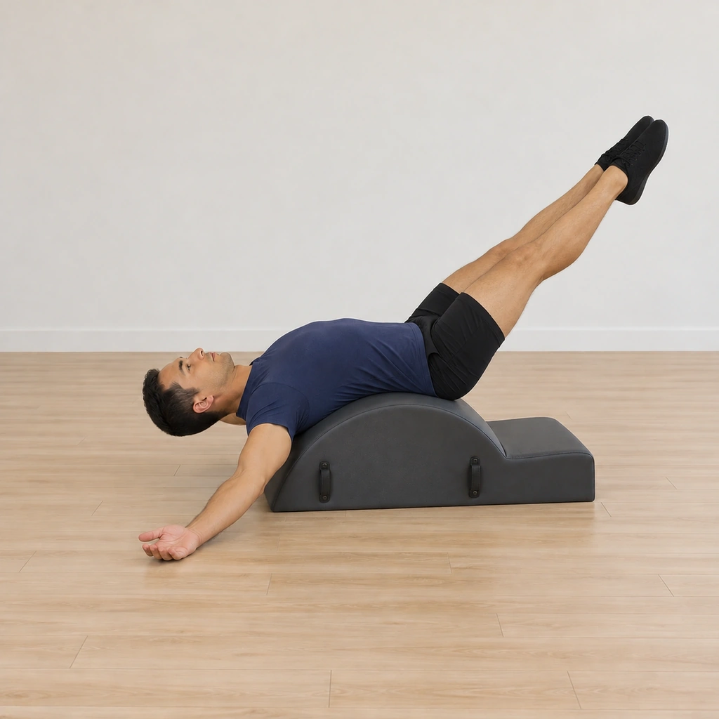 His legs have frogged out to the high diagonal, straight and together with pointed feet, the back and gaze unchanged.