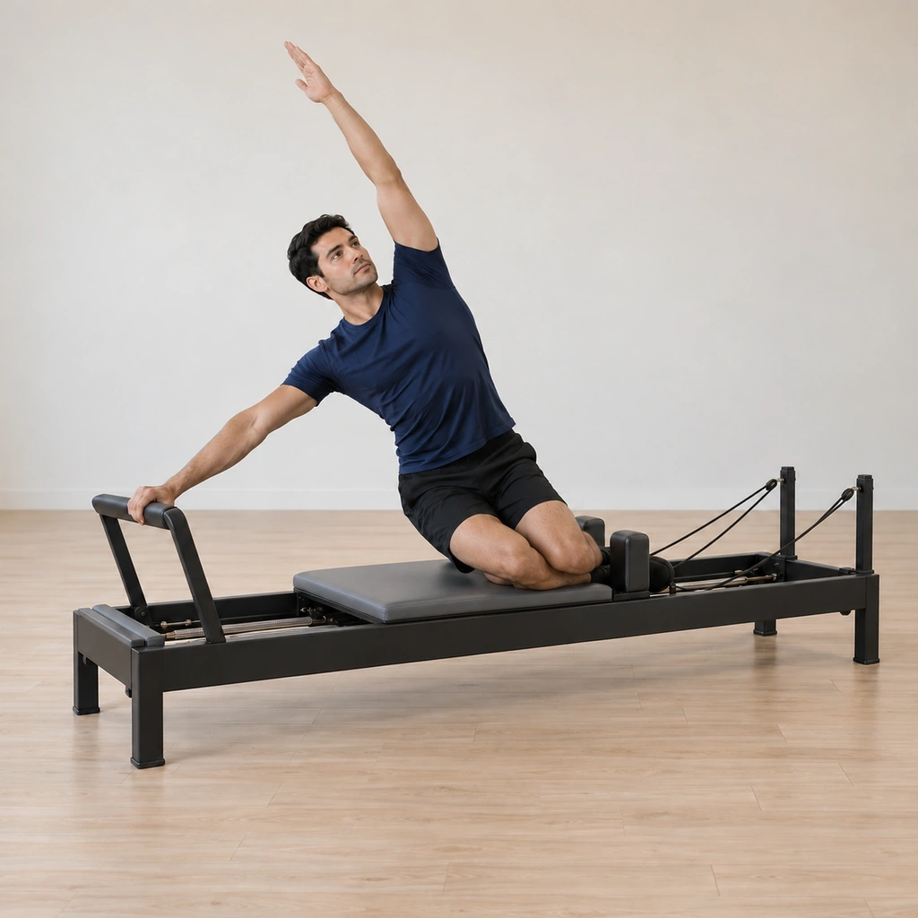 His waist has lifted higher and the carriage has drawn home, his side bend opened long through the lifted waist with the inside hand on the bar and the outside arm reaching.