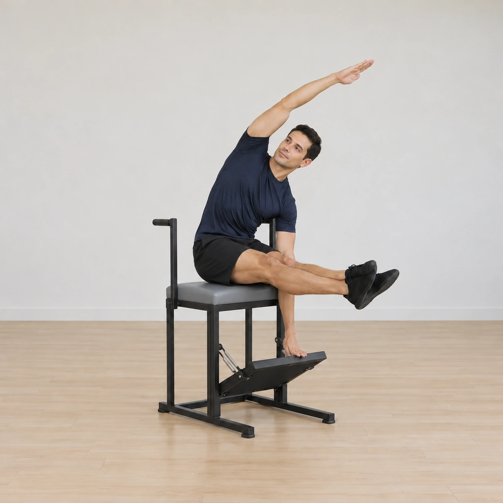 He is arced up and over toward the pedal, his spine in a long lateral curve, the heel of his inside hand just meeting the spring pedal, his outside arm reaching over his ear and his legs still held straight out.