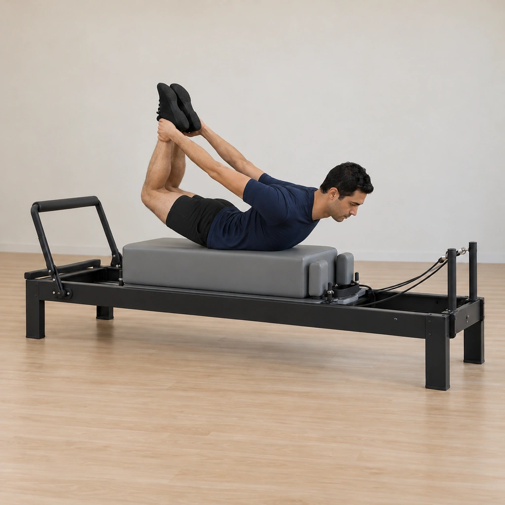 His knees have pressed up off the box and away, his thighs lifted, his chest and thighs drawn into the longest extension by the held grip, his arms connected to his back.