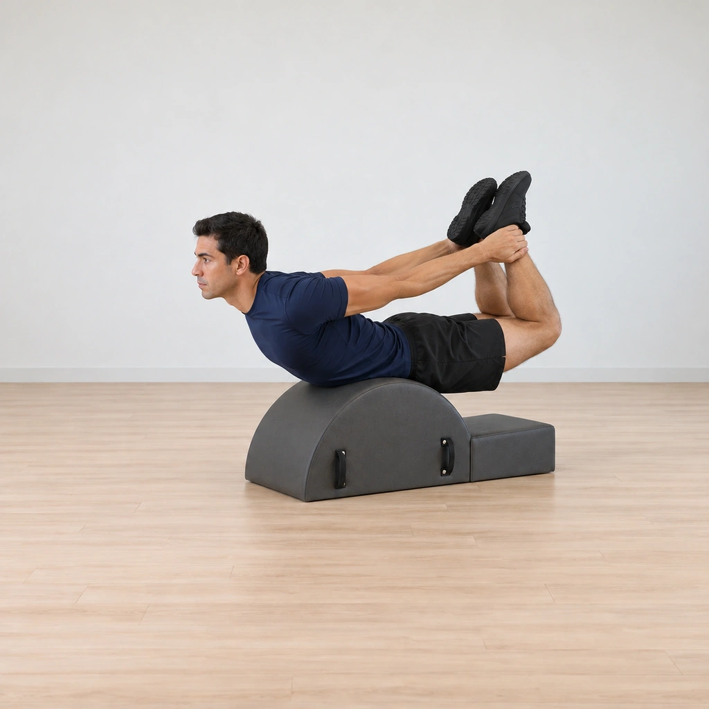 His body rocks on the corrector's hump, his ankles pressing into his hands as his legs lift and his chest reaches forward through the rock.