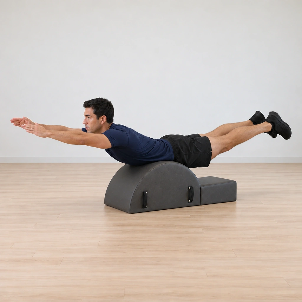 He holds the superman position over the hump, arms reaching forward and legs reaching back, showing the controlled finish.
