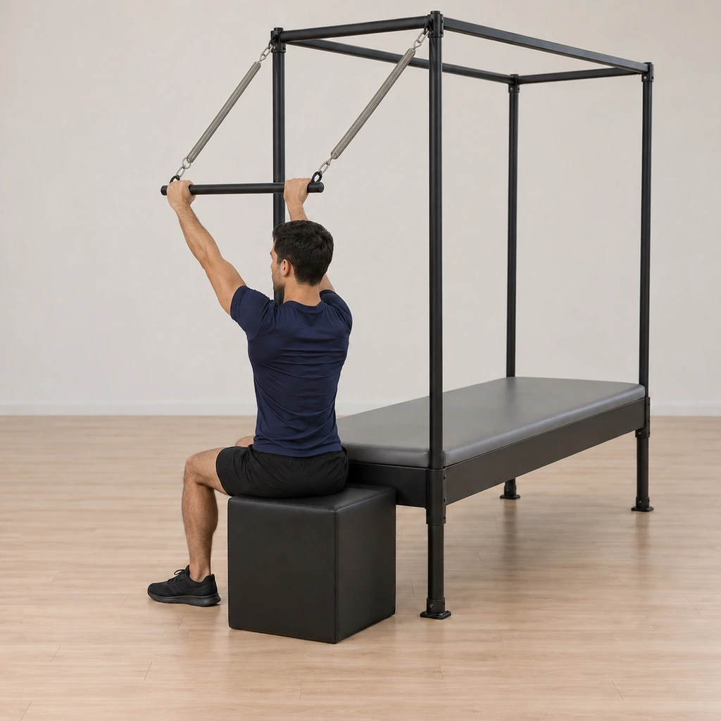 His arms extend reaching the sprung bar forward and up, driven from where the arms connect to his back, his torso upright and his palms out on the bar.