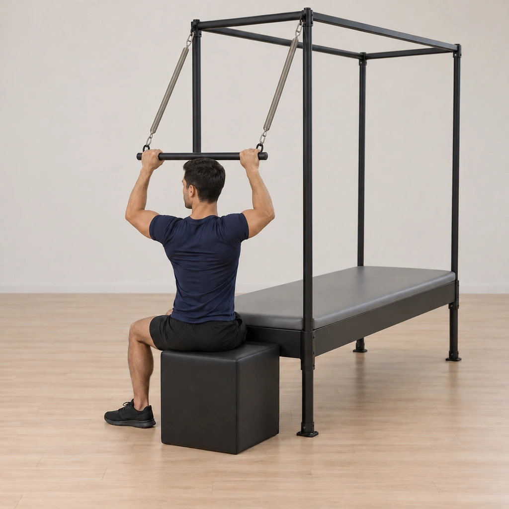 His arms bend as he resists the spring pulling the bar back closed, the whole palm staying connected, his torso upright.