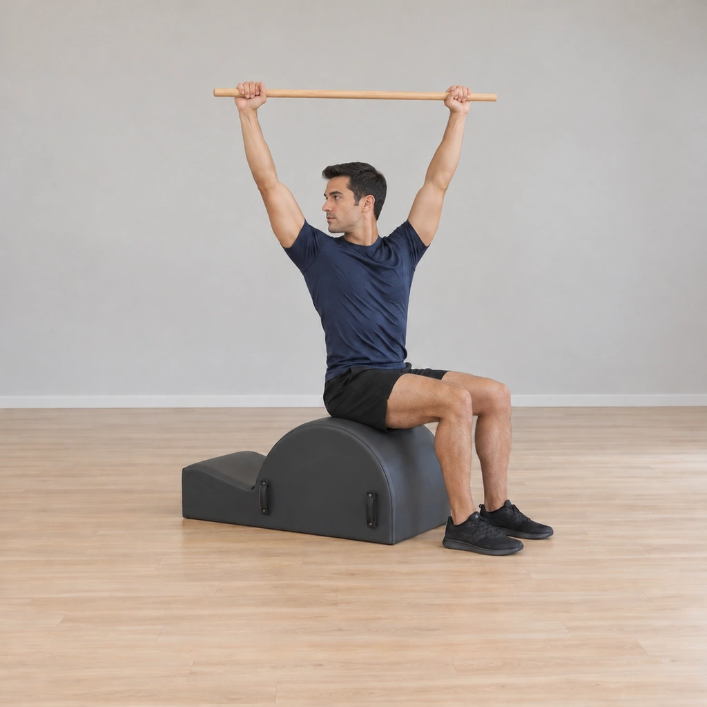 He is twisted at the waist toward the right - the pole carried with him, his hips still square and unmoved on the apex.